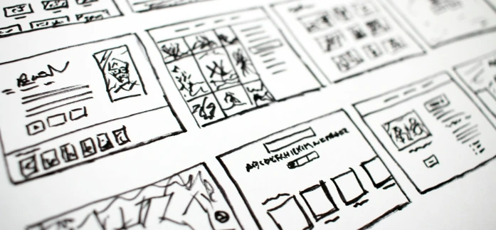 Architectural spatial layout sketches and website wireframe concepts